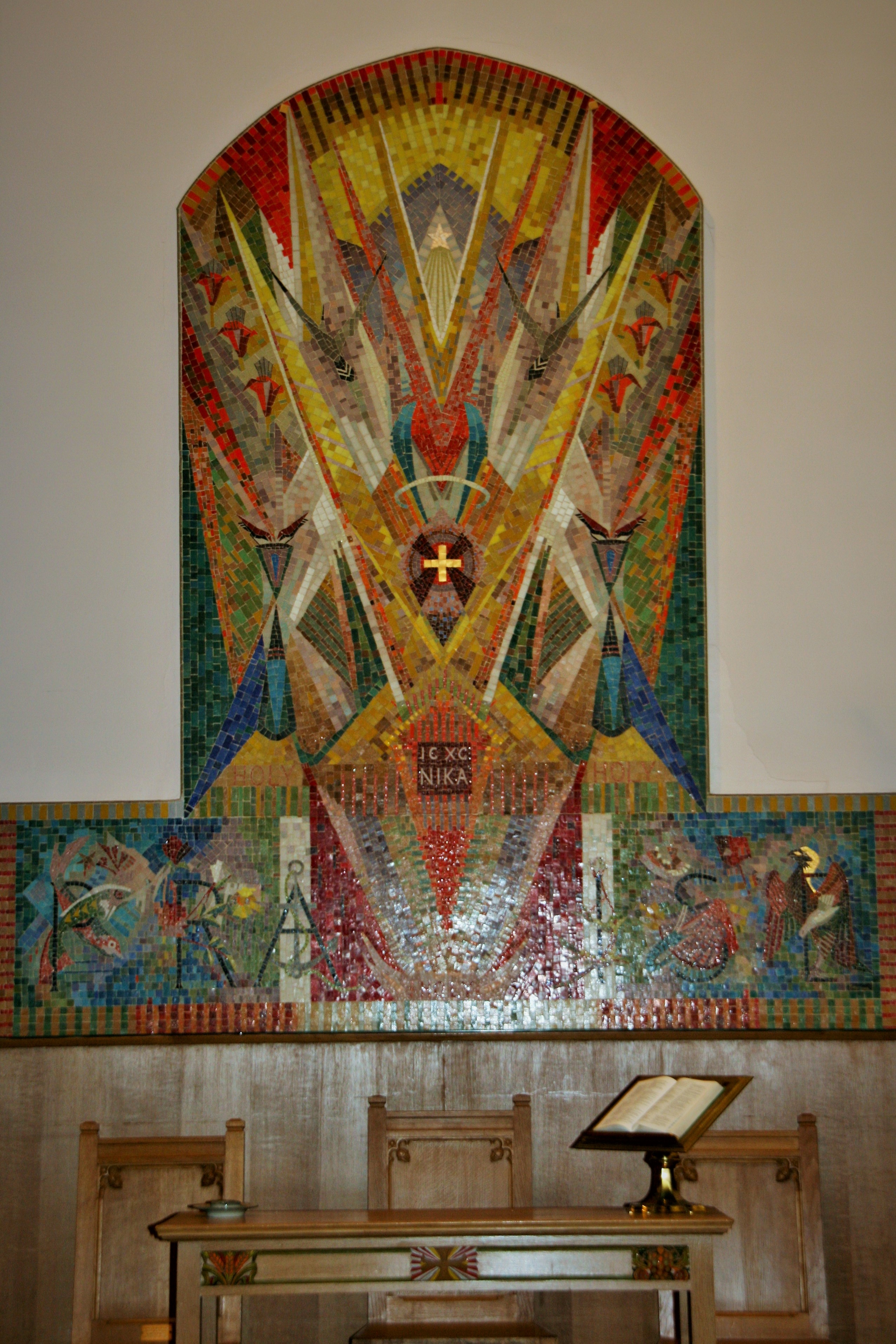 A large, colourful mosaic on a wall.